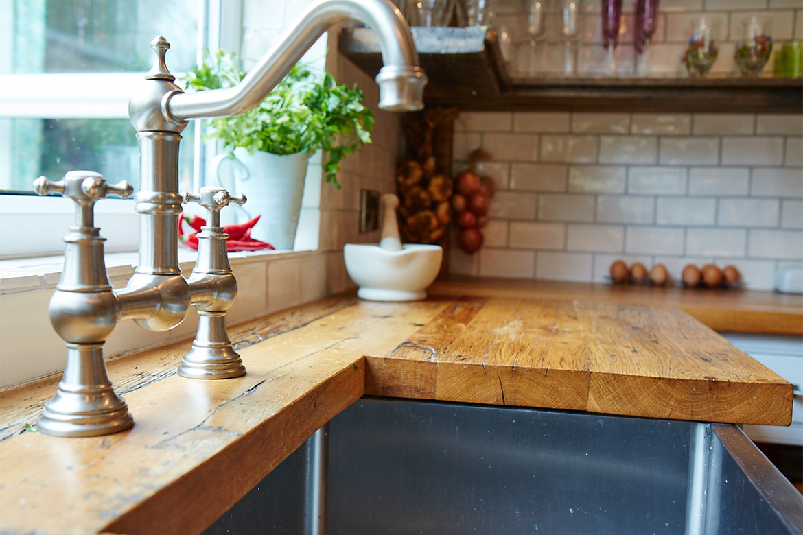 Abode pewter tap with stainless steel belfast sink and reclaimed pine worktops