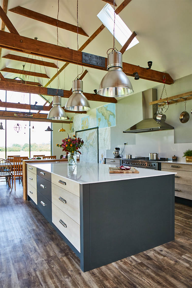 Kitchen island with dekton work surface and 3 large pendant lights