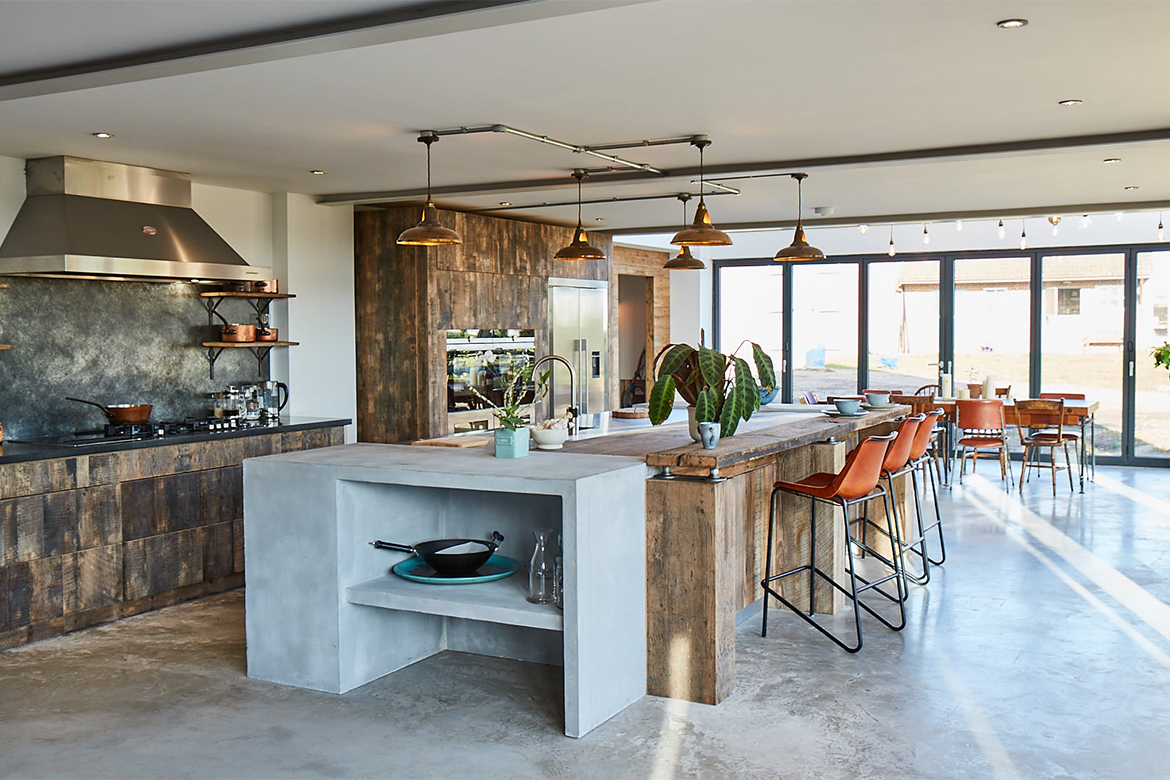 Bespoke kitchen island with concrete ends reclaimed oak wood breakfast bar and stainless steel worktop