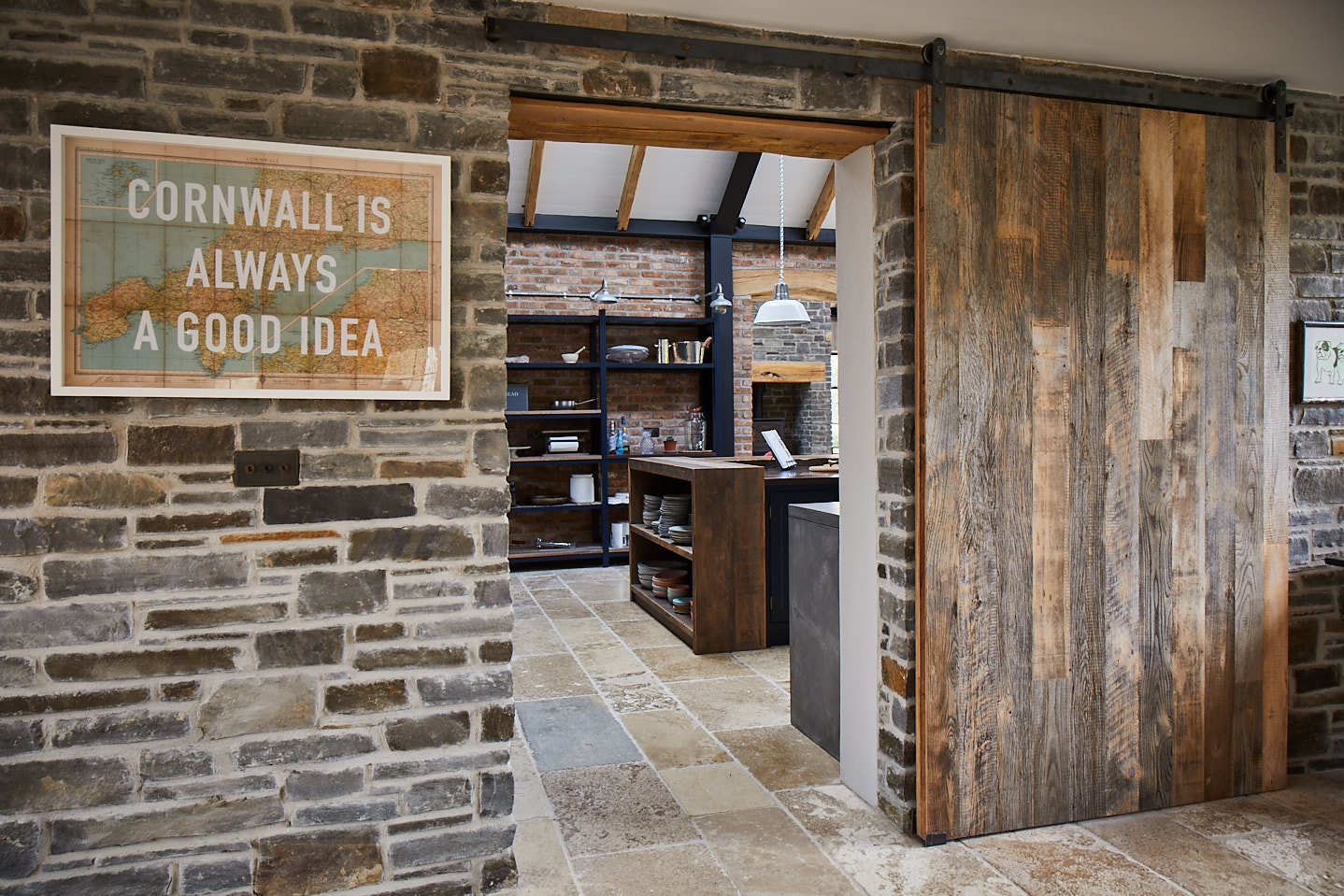 Cornwall is always a good idea sign with The Main Company sliding barn door