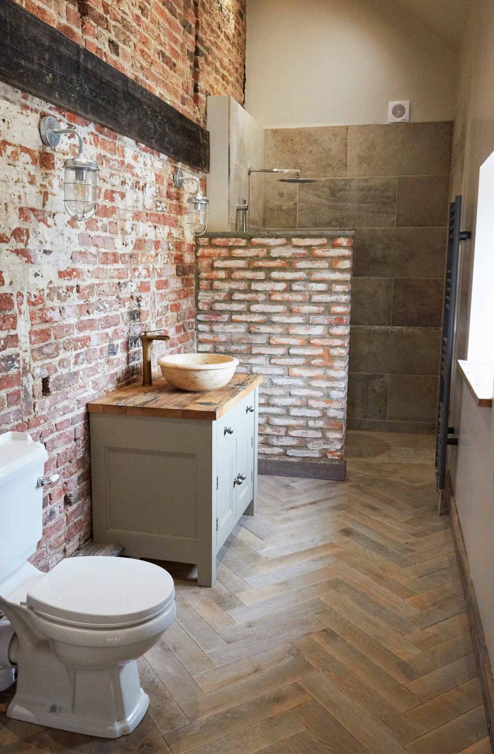 Oak herringbone flooring in bathroom