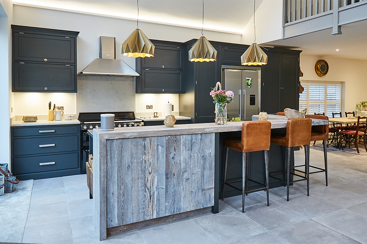 Light brown leather bar stools under distressed reclaimed white wash timber wood breakfast bar