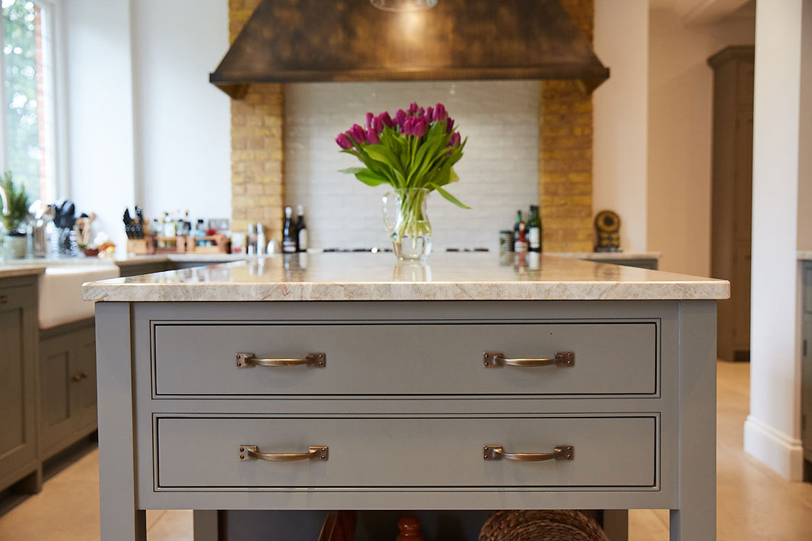Two drawers in pot board island end with Centaurus grey granite painted grey moss by Little Greene