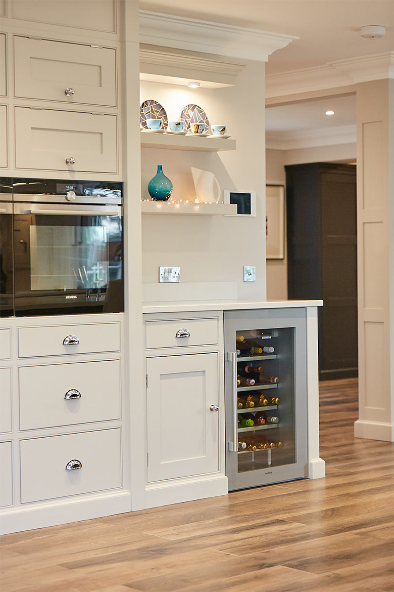 Semi integrated stainless wine cooler with white granite worktop