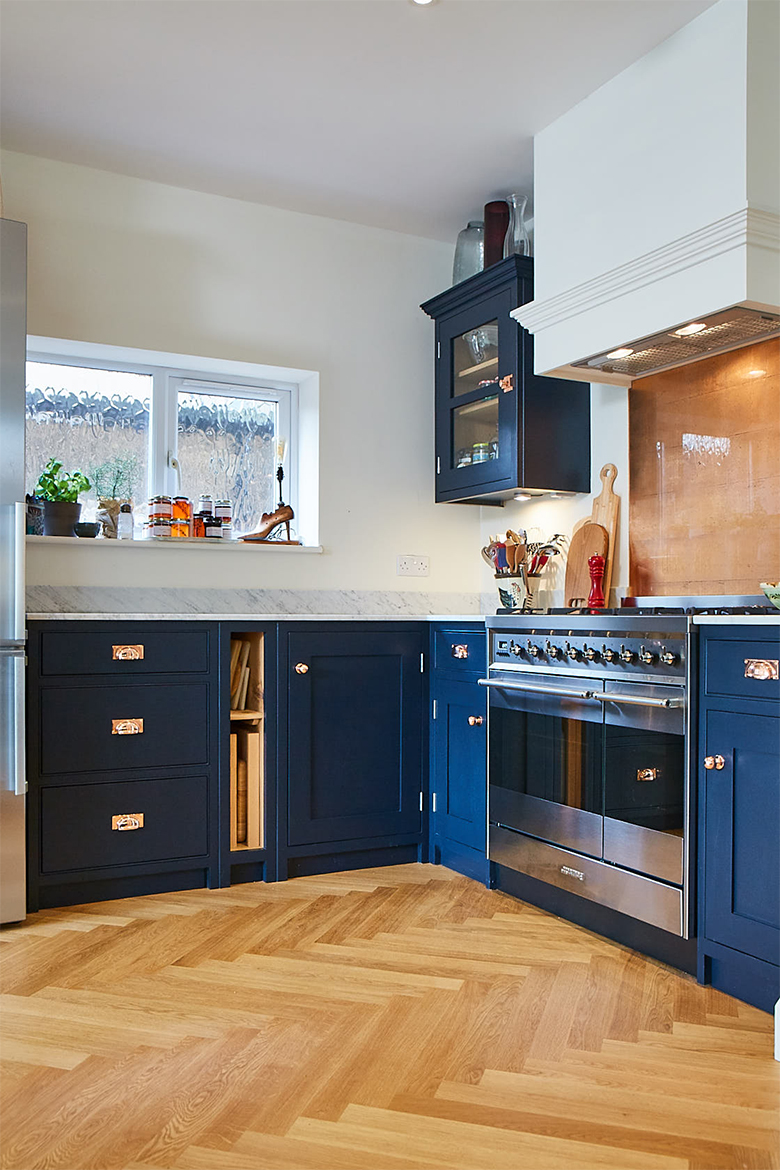 Cooker run painted in dark blue with tray space and pan drawer units