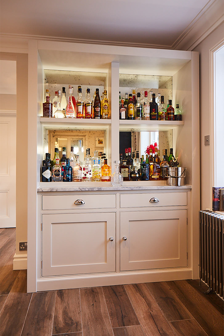Bespoke painted shaker drinks cabinet with aged mirror back drop