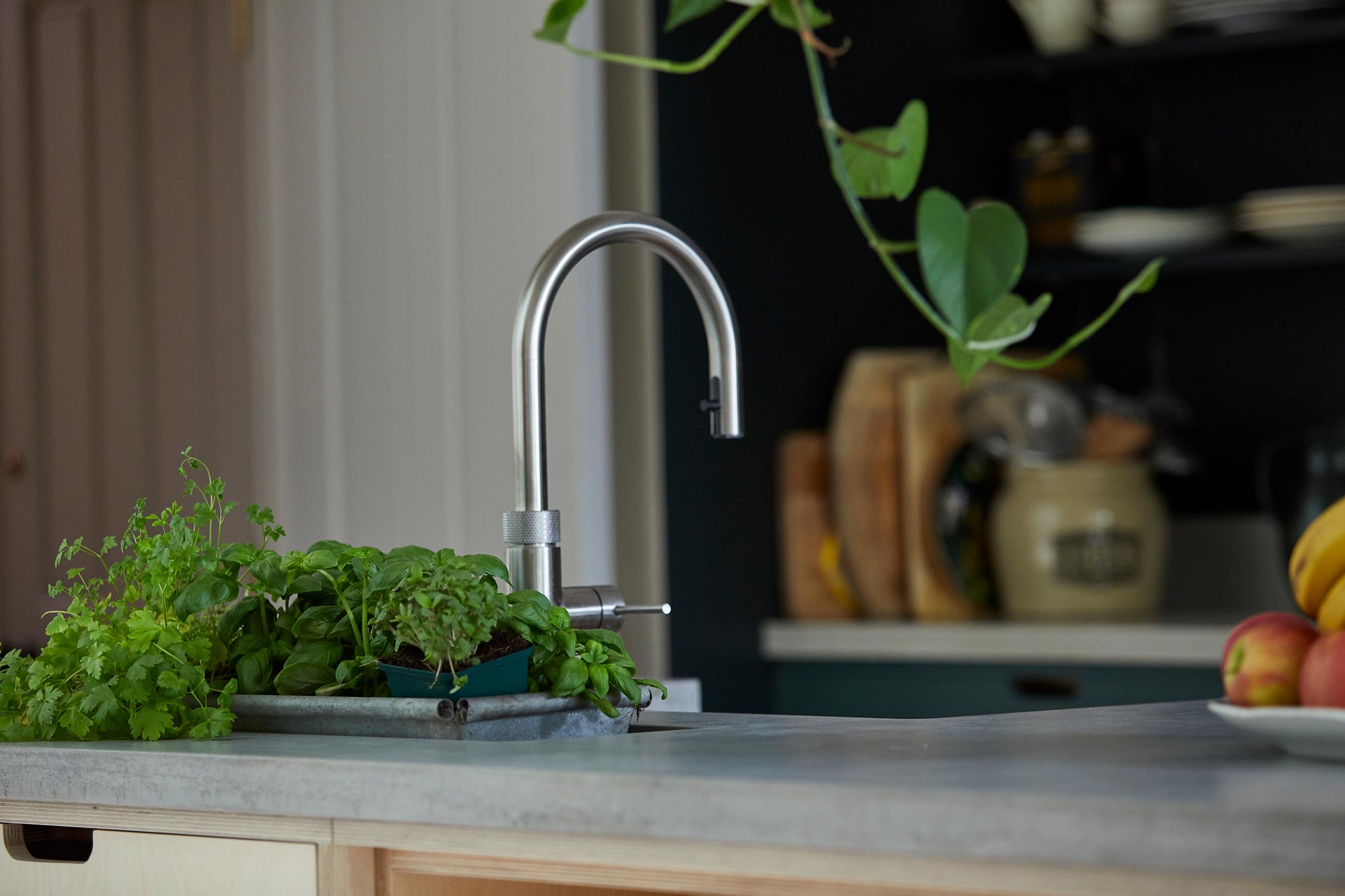 Brushed stainless Quooker hot water tap on concrete worktop