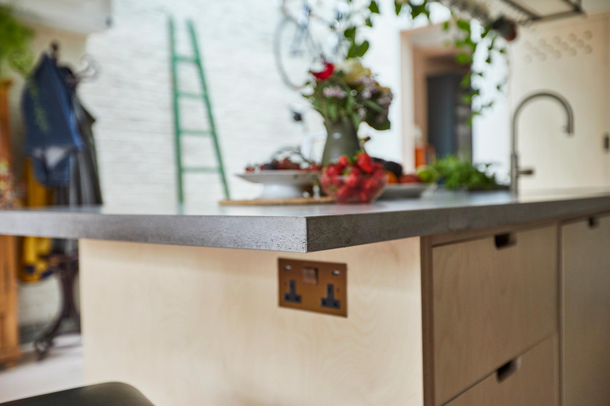 Solid concrete worktop on bespoke plywood kitchen island