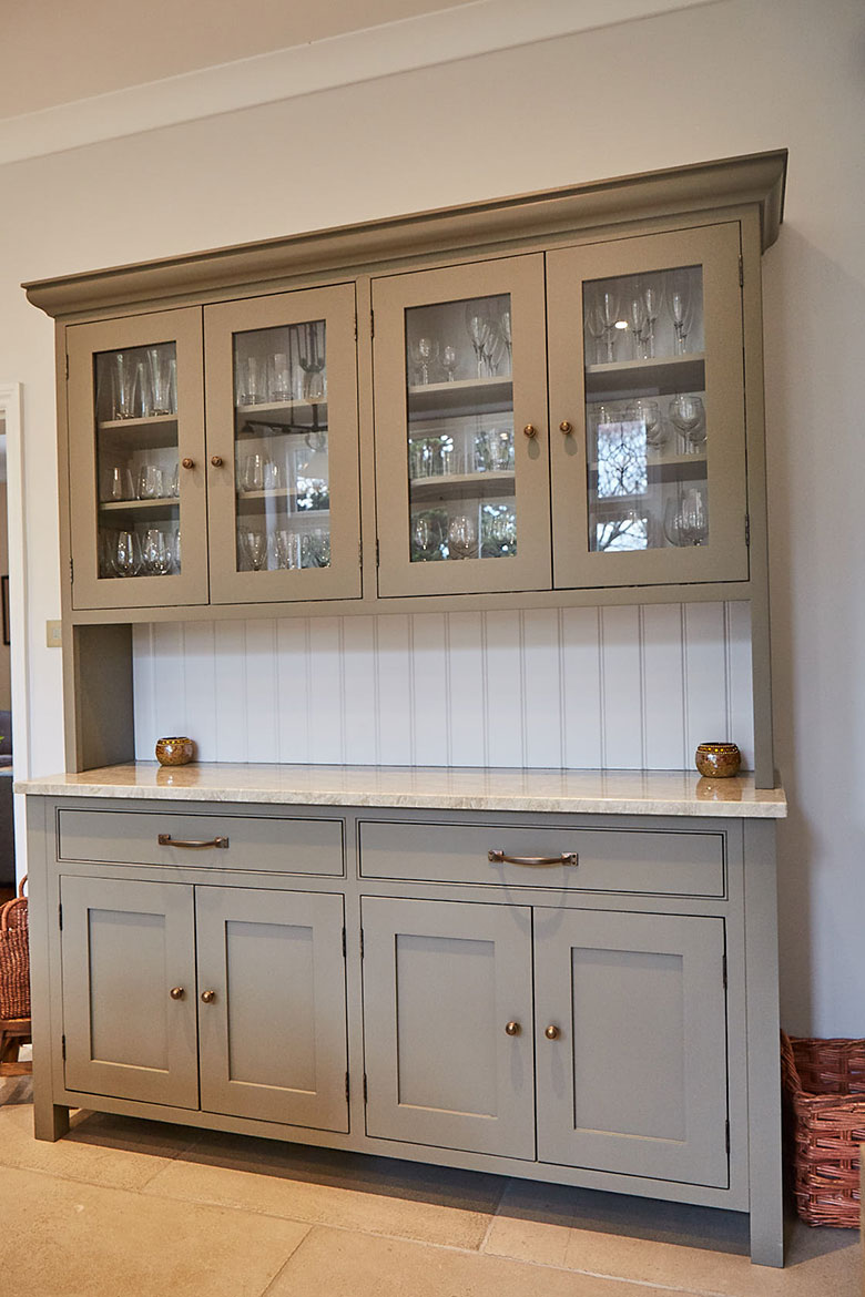 Freestanding grey moss dresser with painted white tongue and groove back boards