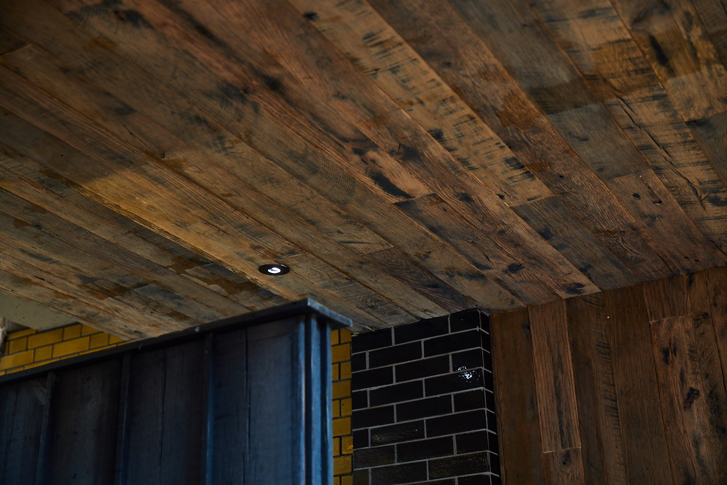 Reclaimed oak ceiling with integrated down lights