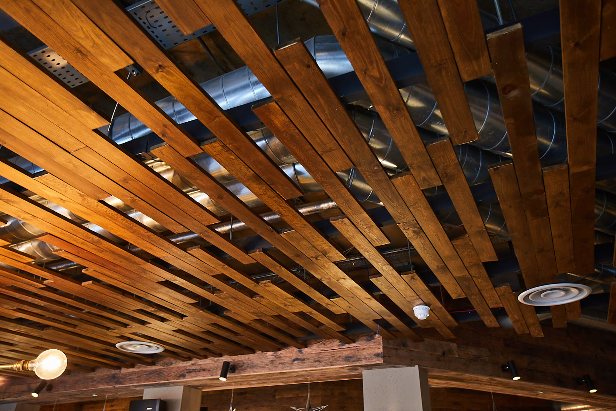 Oak wood planks used as eatery ceiling