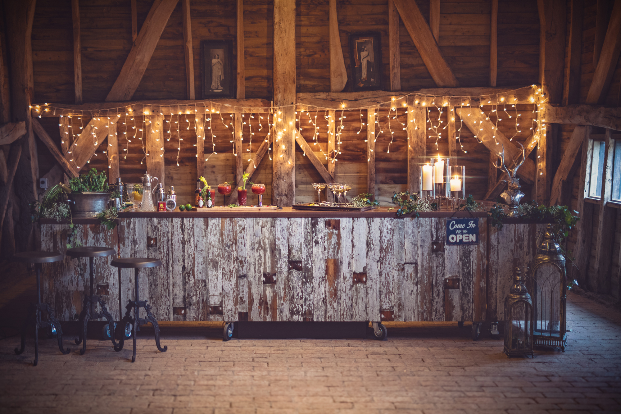 Fairy lights behind distressed wooden bar