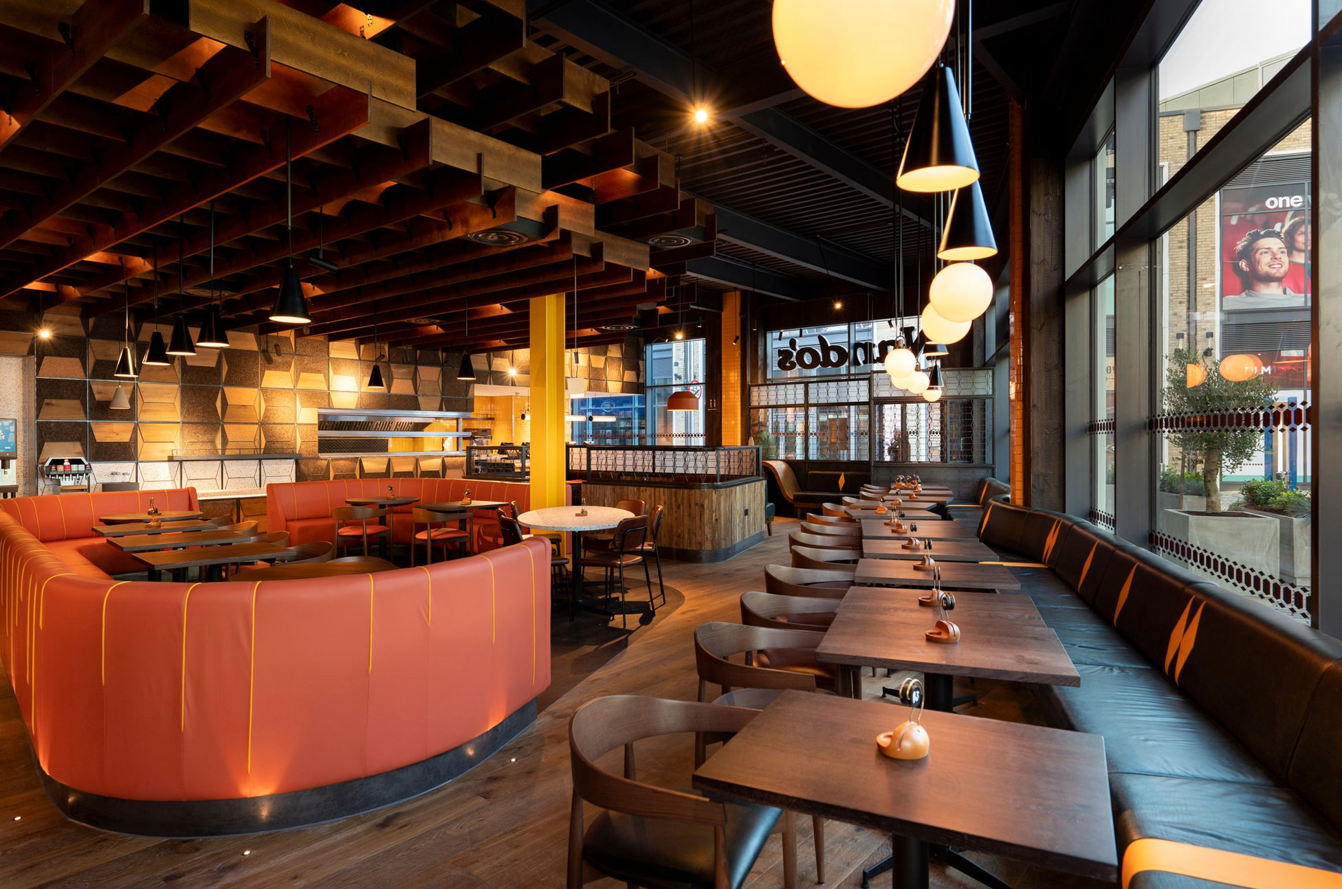 Leather circular booth in open plan dining area