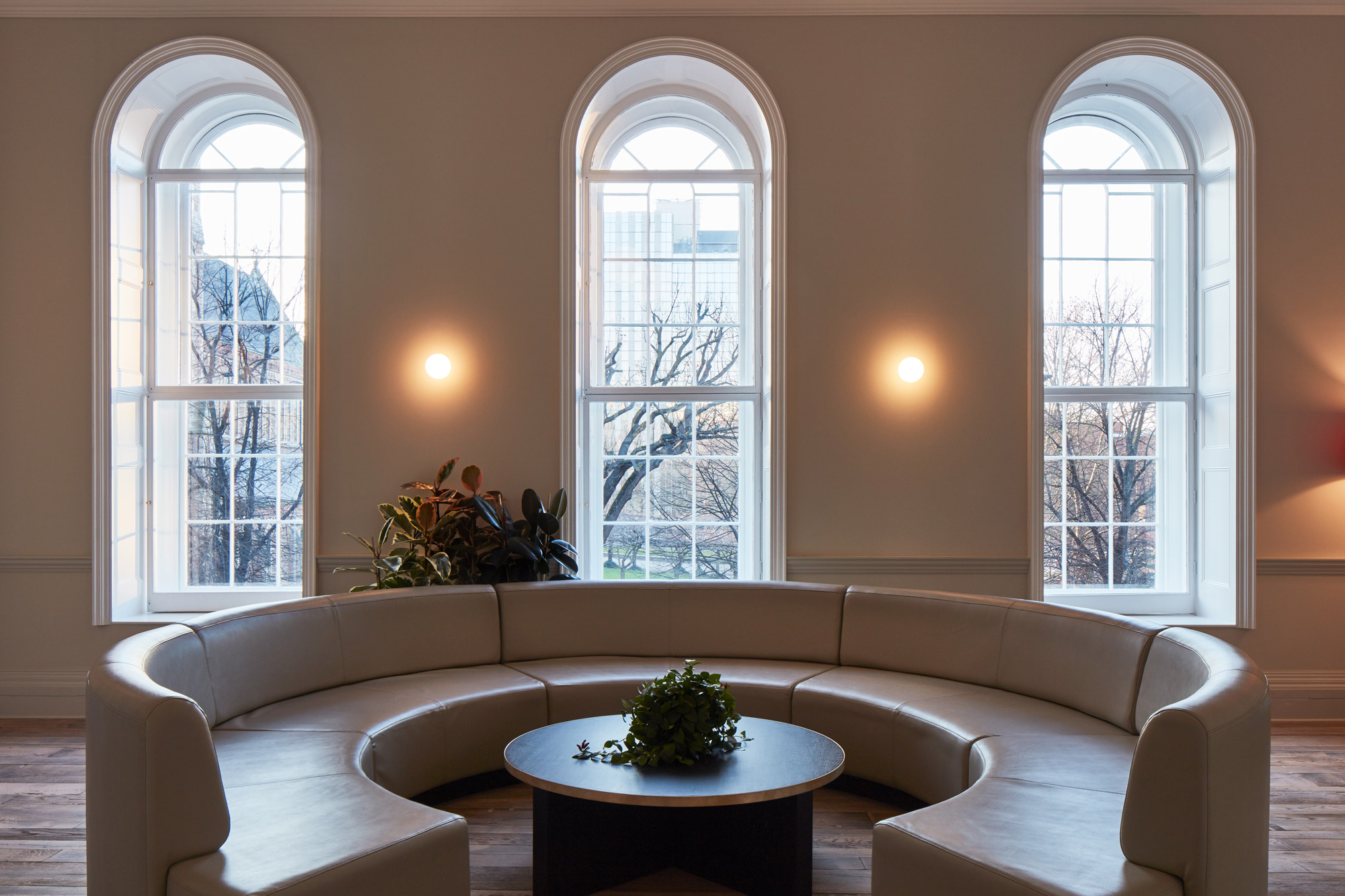 Round leather white seating booth with coffee table