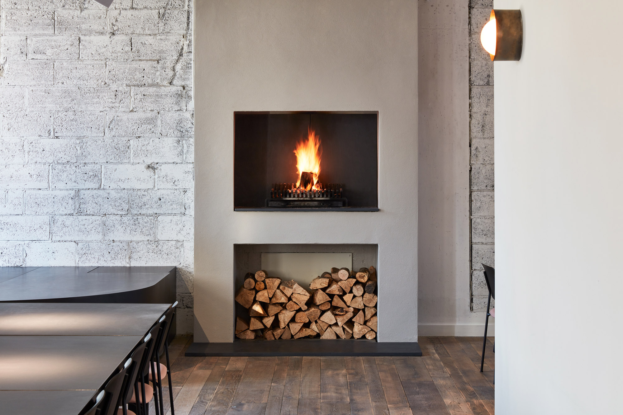 Concrete fireplace with log storage below