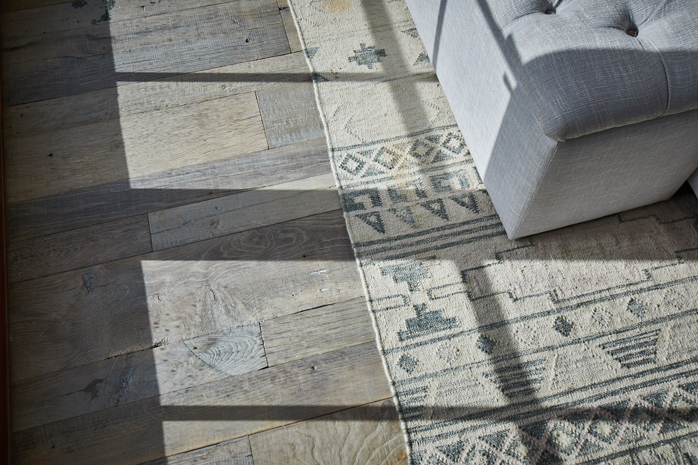 Light shining across reclaimed oak floorboards