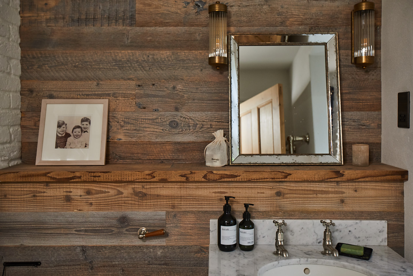 Reclaimed spruce wood wall cladding with freestanding vanity