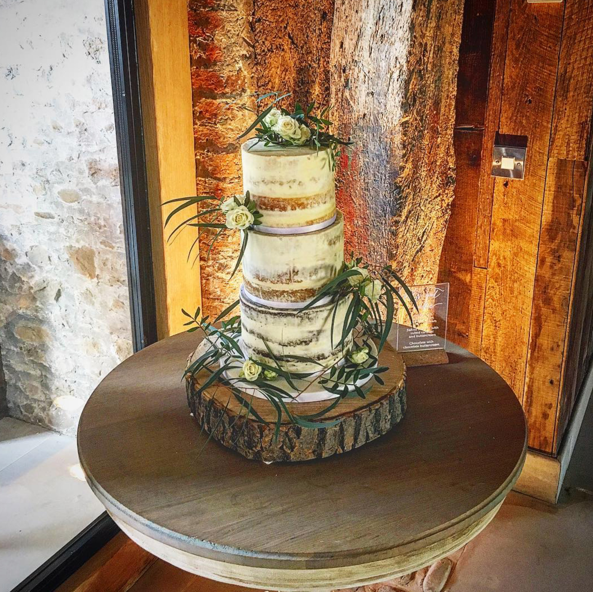 Wedding cake with rustic oak base