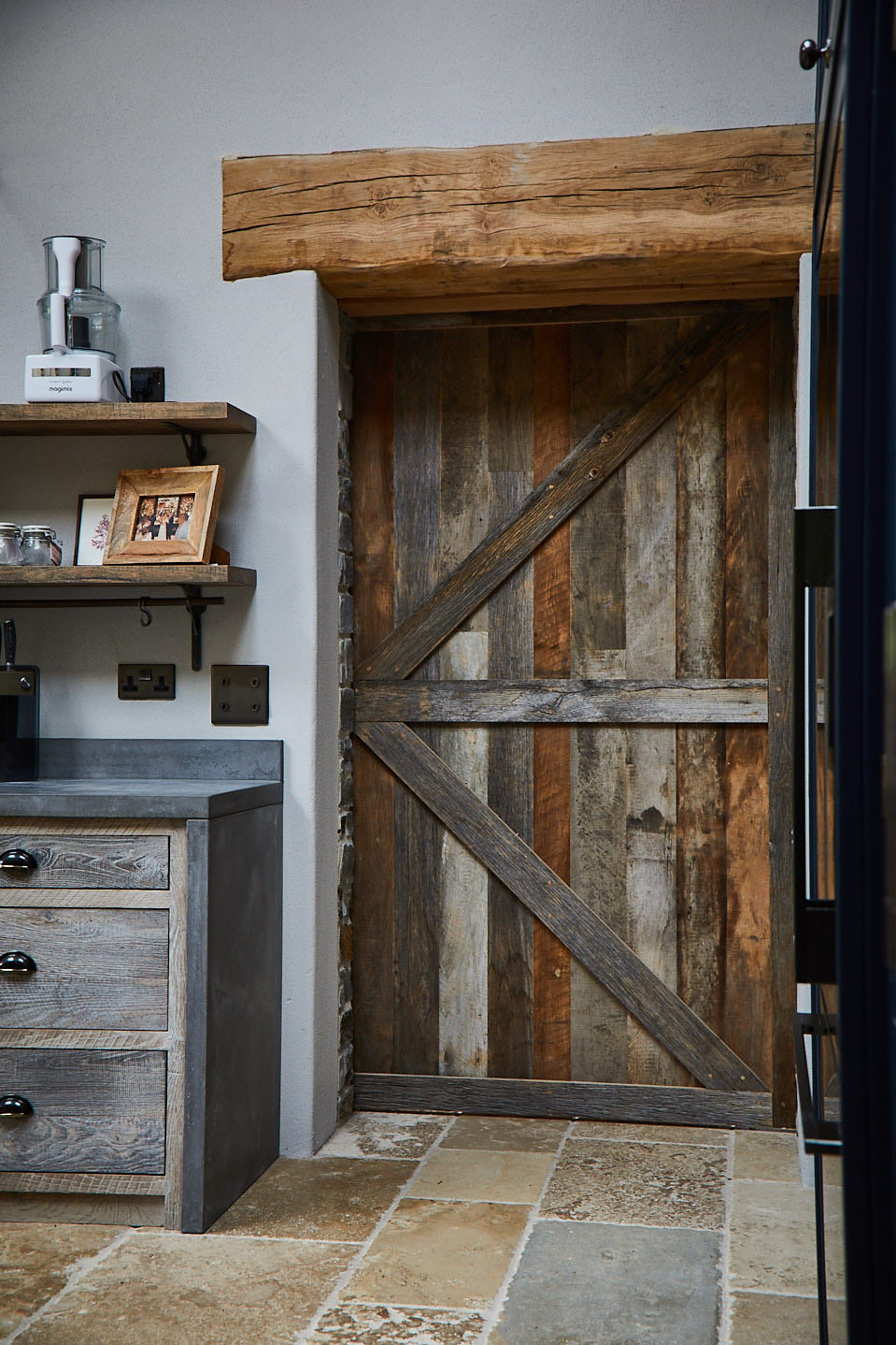 Internal closed reclaimed timber sliding barn door with cream tiles