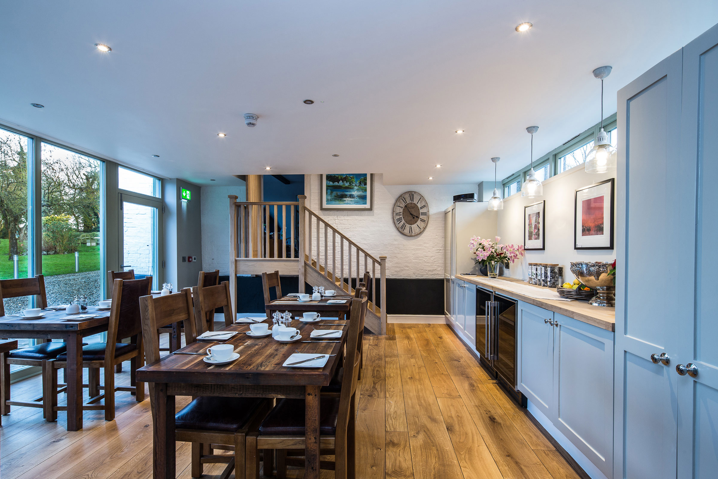 Cream kitchen with oak floor and reclaimed oak table