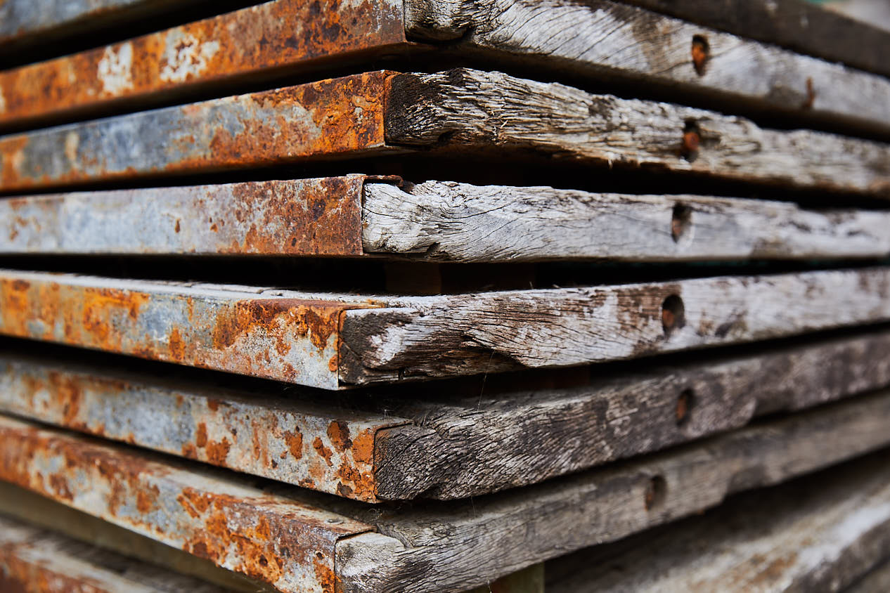 Large stack of unprocessed reclaimed oak timber wood