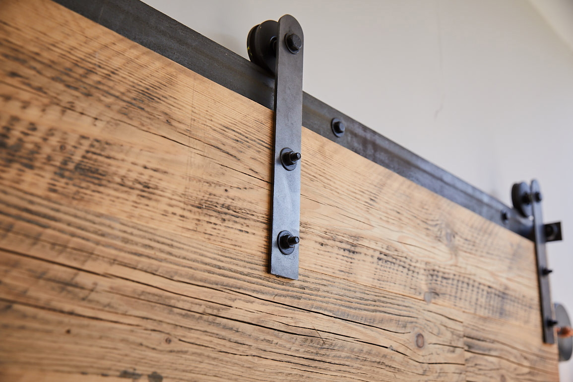 Rubbed oil steel rail for sliding barn door