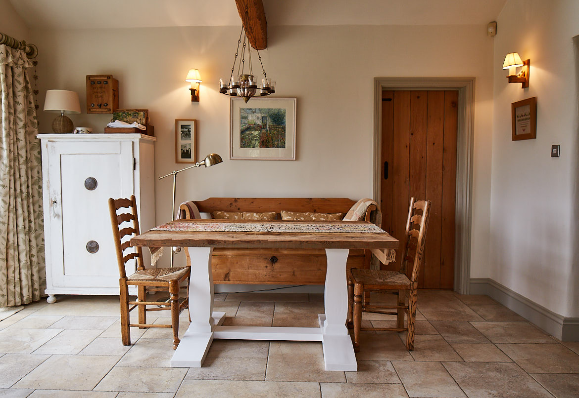 Bespoke table with cream painted base and pine wood chairs