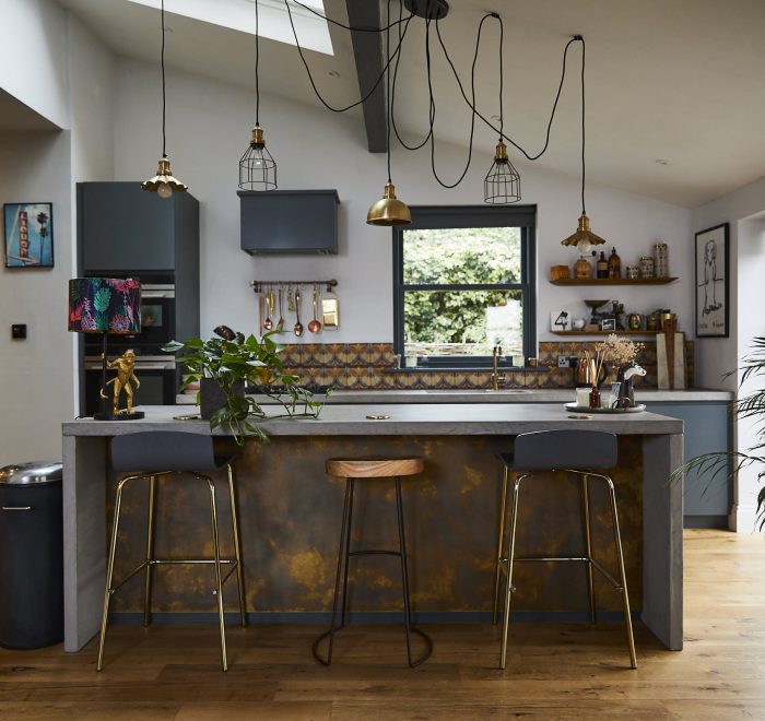 Antique brass and concrete bespoke kitchen island with bar stools