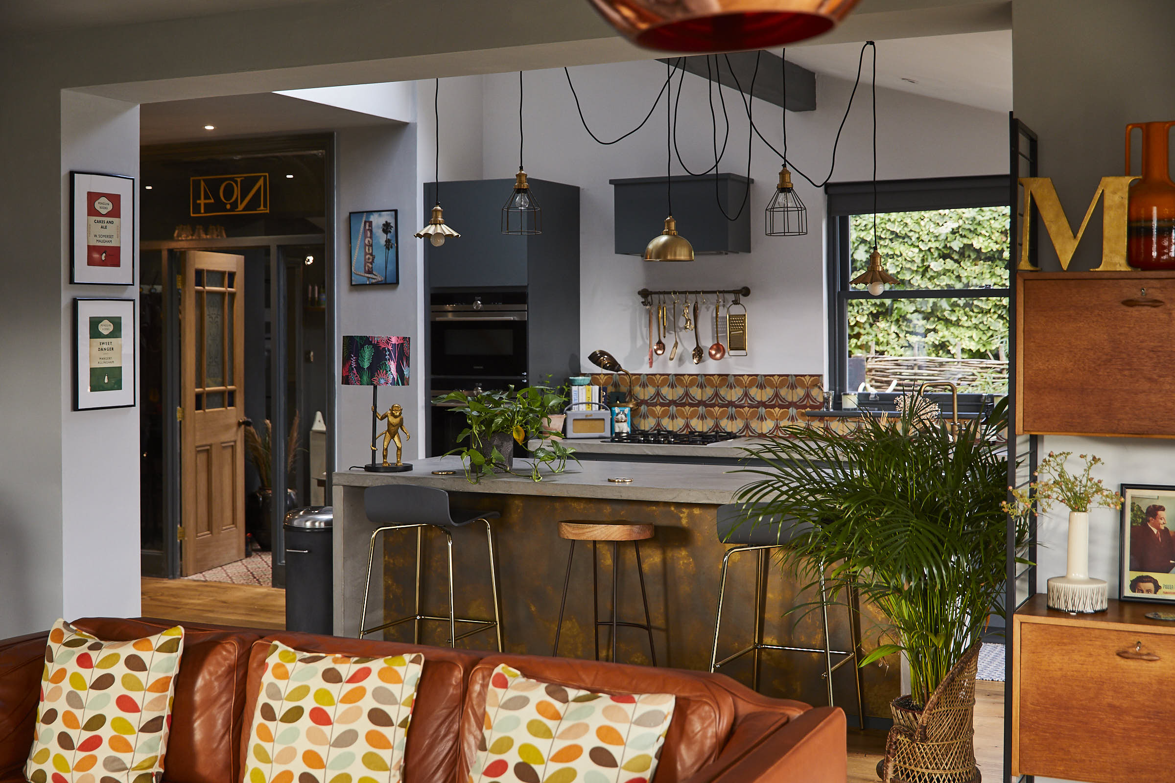 Brown leather sofa in front of bespoke kitchen island