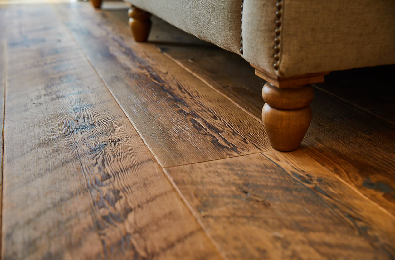 Sofa feet sat on distressed floor