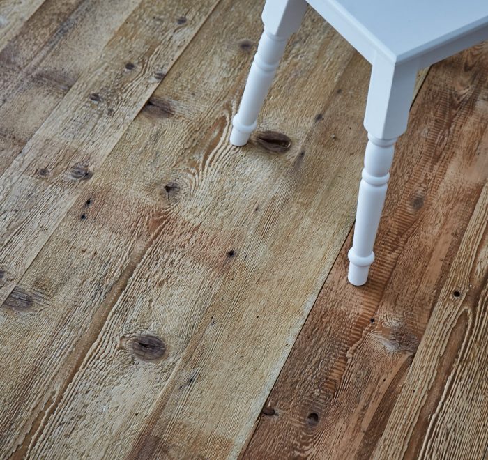 Industrial mill board flooring with white painted stool