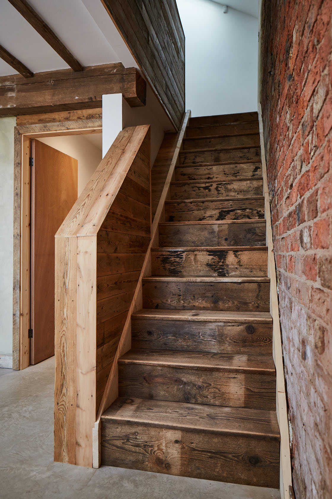 Stairs clad in reclaimed timber