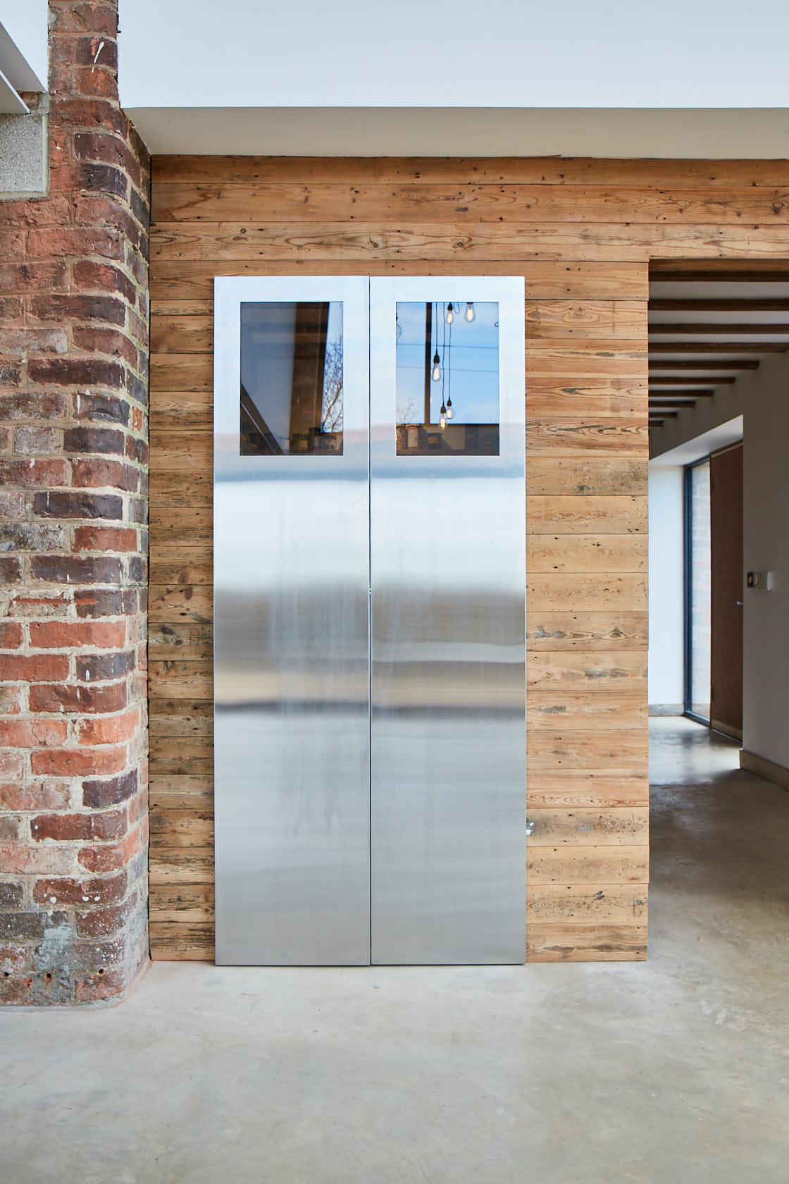 Stainless steel doors lead to pantry