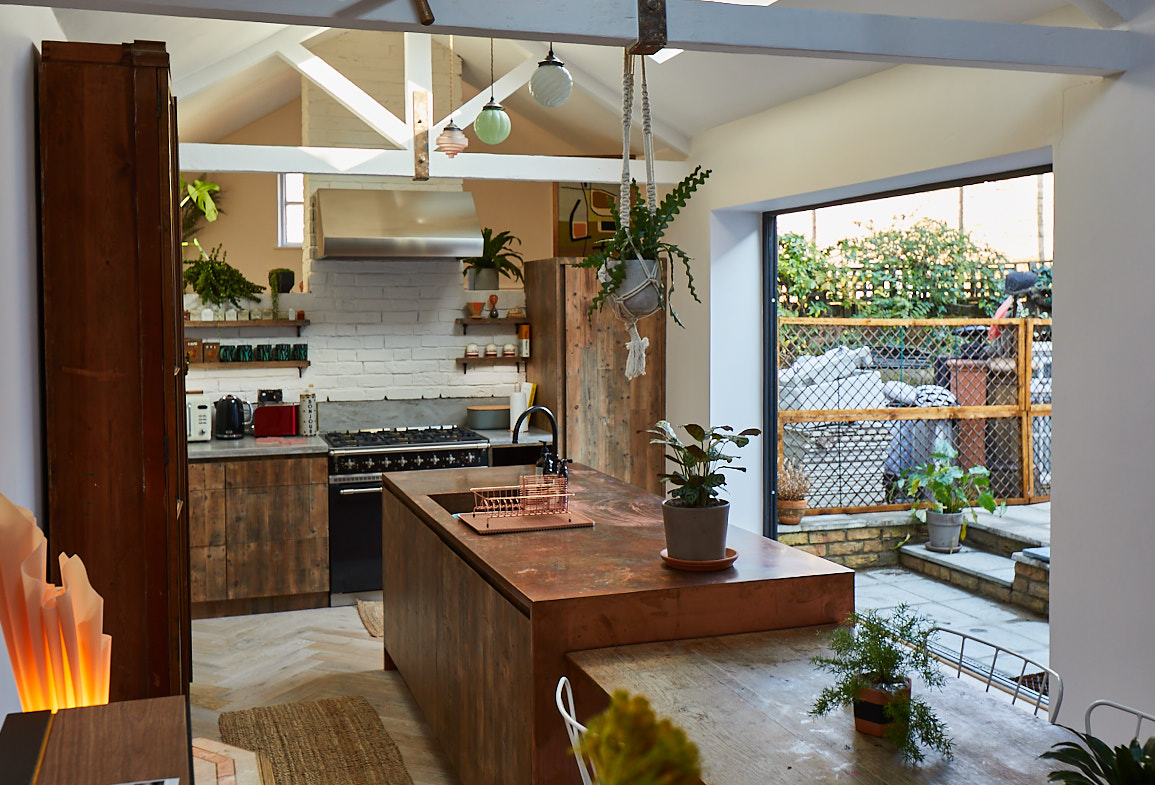 Bespoke kitchen island made from reclaimed pine and antique copper