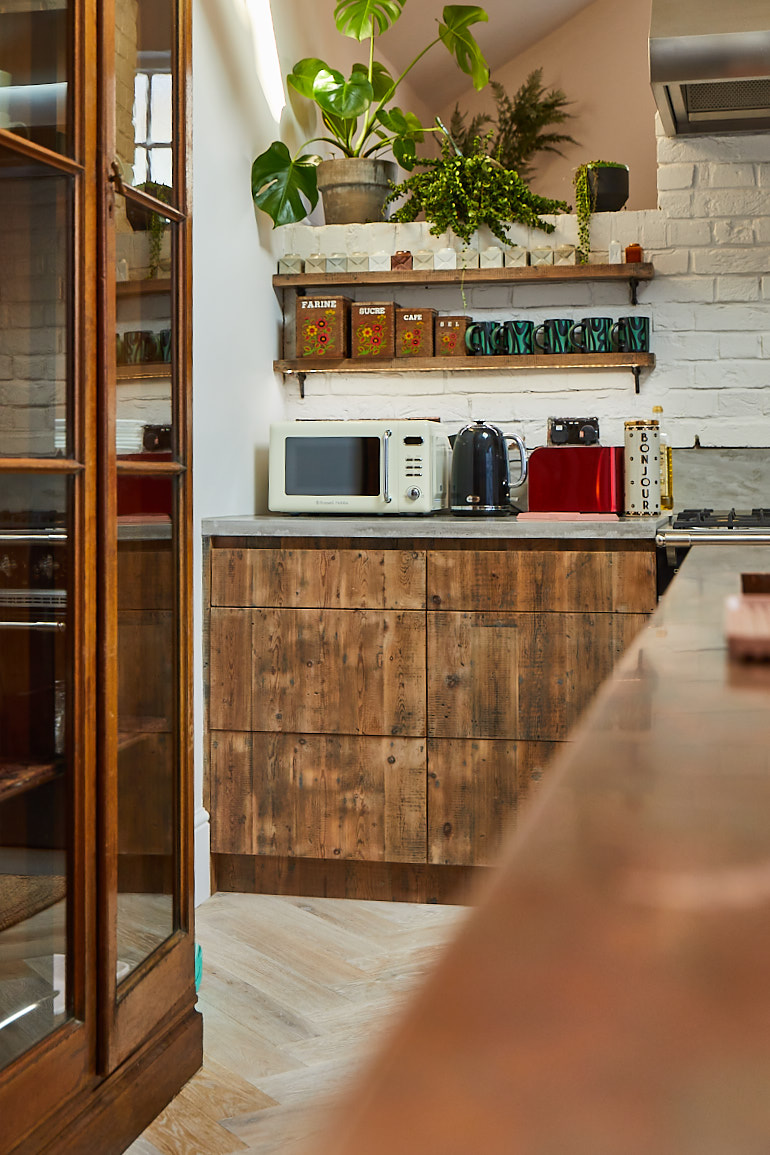 Reclaimed pan drawers and open shelves in bespoke kitchen