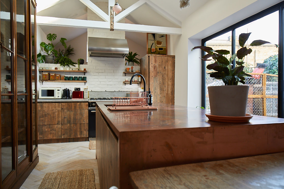 Reclaimed bespoke kitchen with copper and concrete worktops