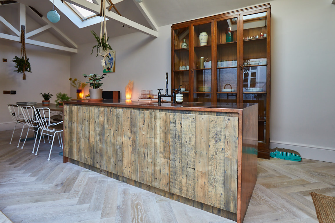 Engineered kitchen island with reclaimed pine and copper worktop