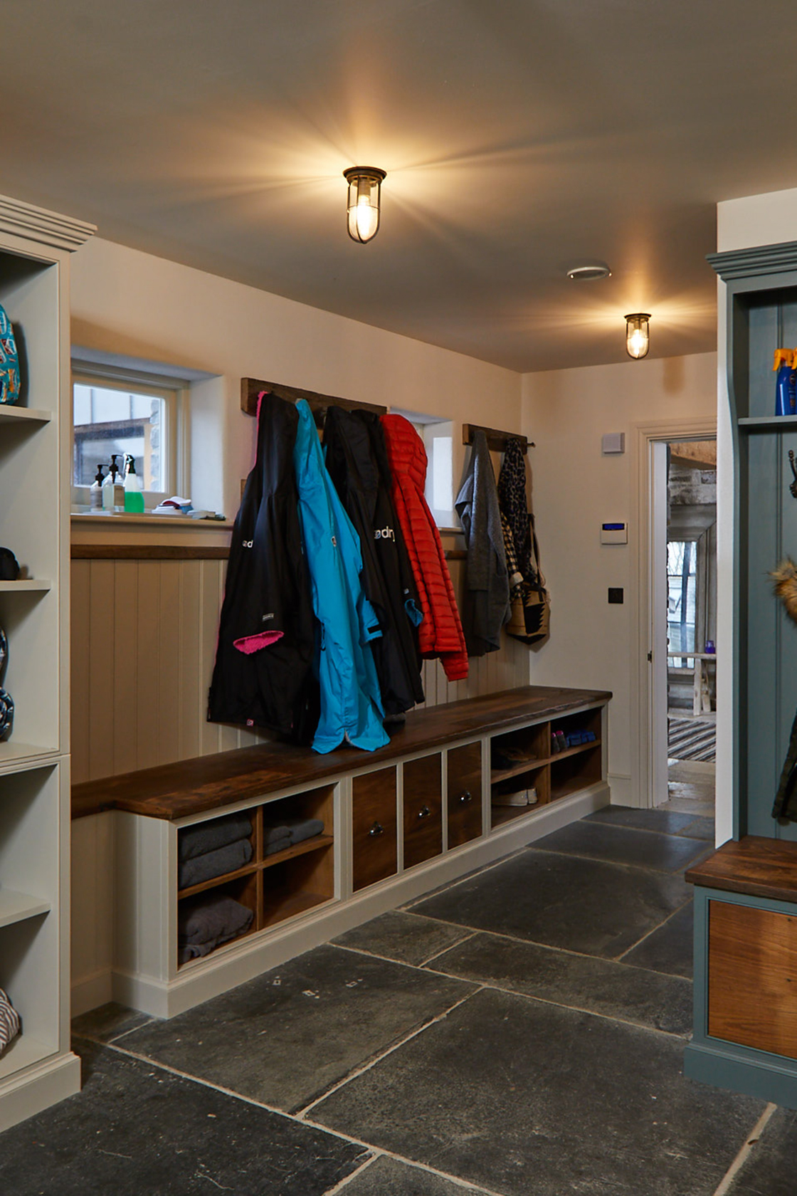 Traditional boot room with fitted furniture painted