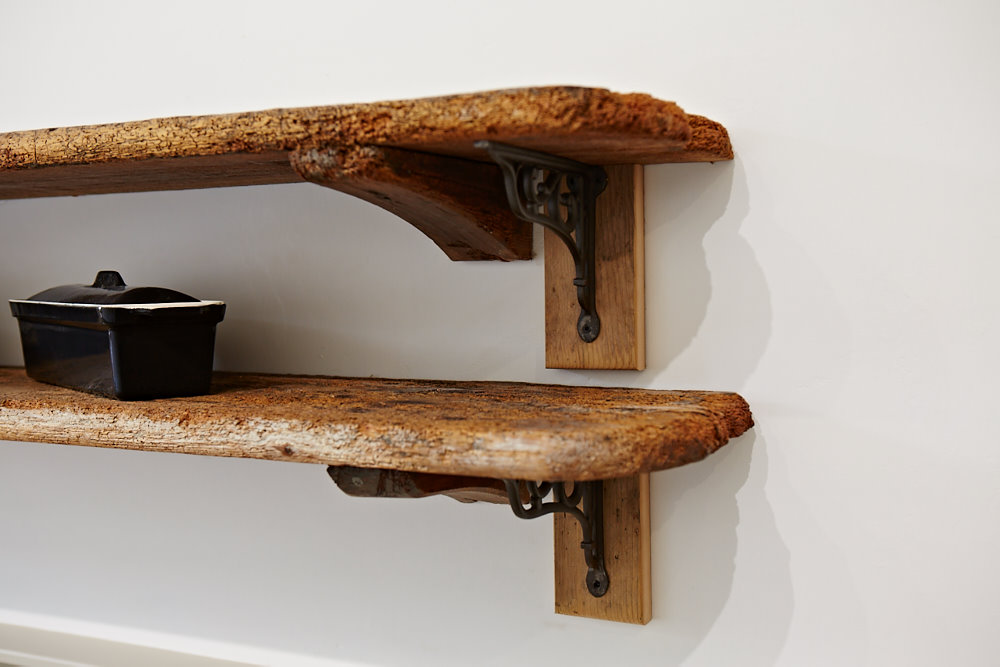 Reclaimed open shelves with cast brackets