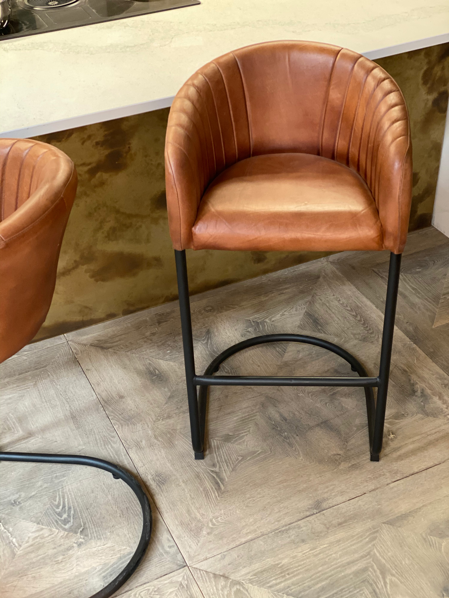 Brown leather and black metal tube base bar stool