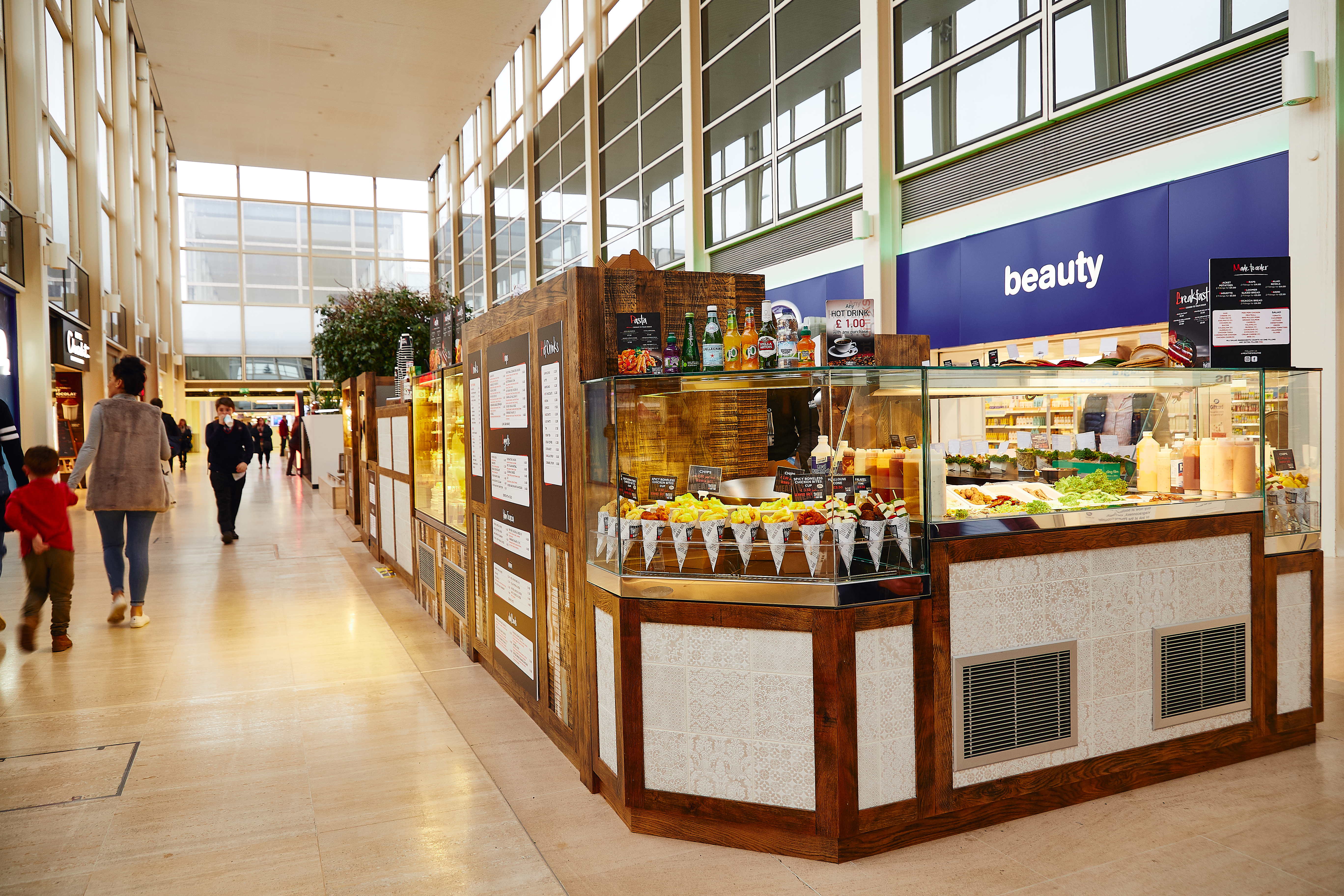 Commercial fridges with bespoke joinery facia including white tiles and reclaimed wood