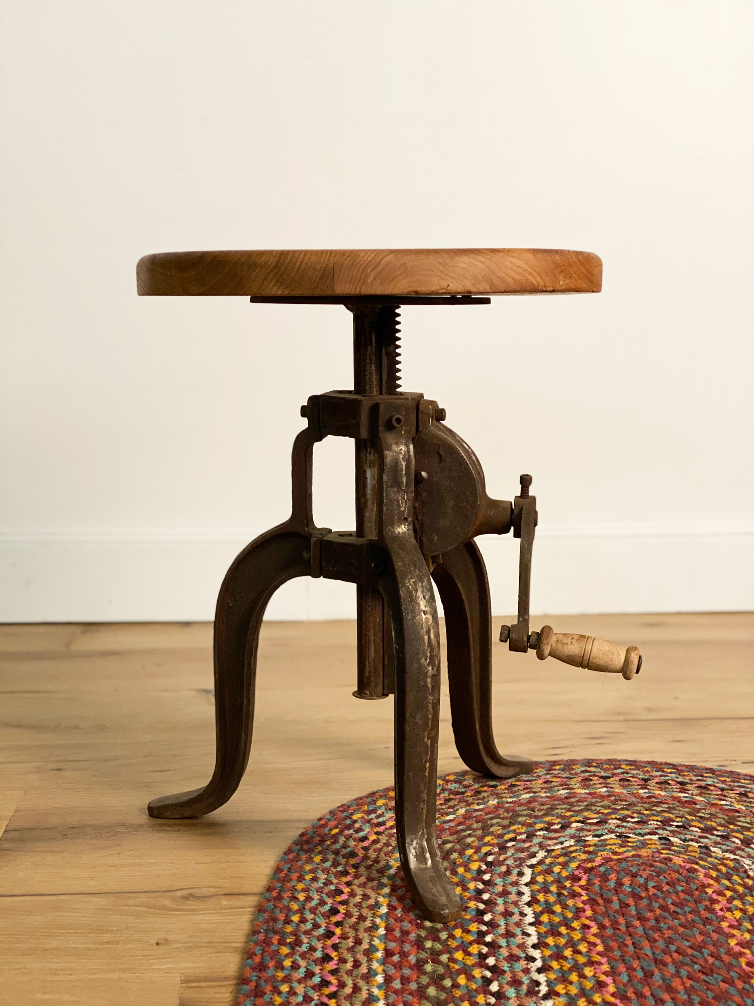 Cast iron adjustable base with reclaimed oak table top