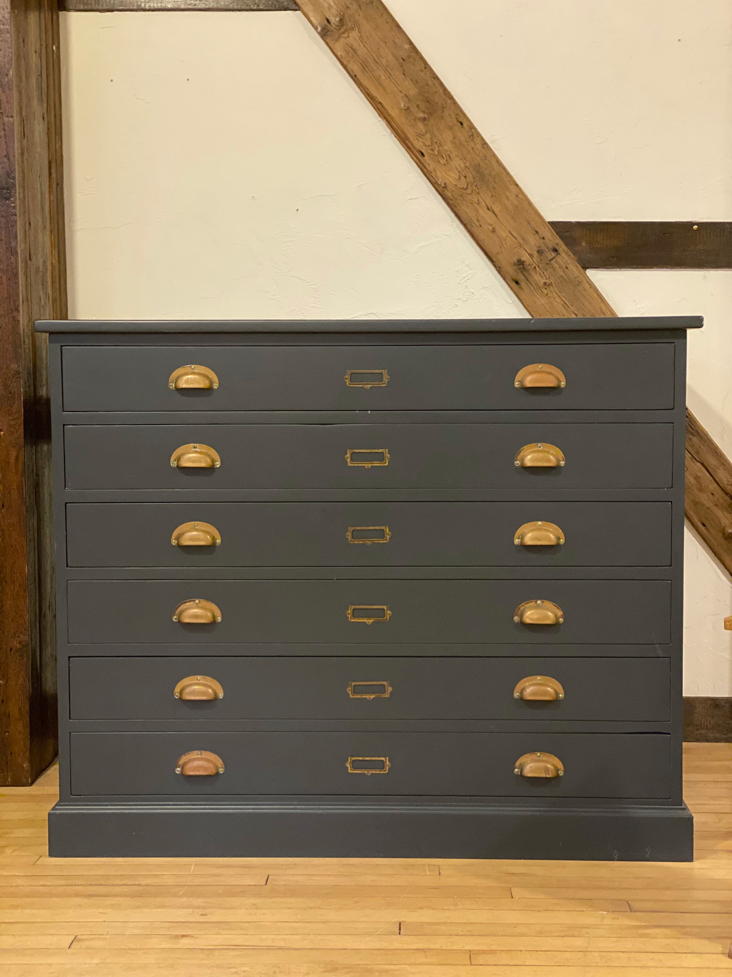 Original plan chest painted in blue with burnt brass cup handles