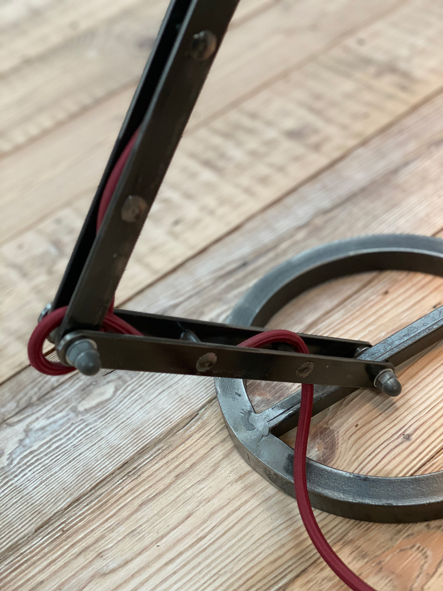 Industrial lamp base with red textile cord