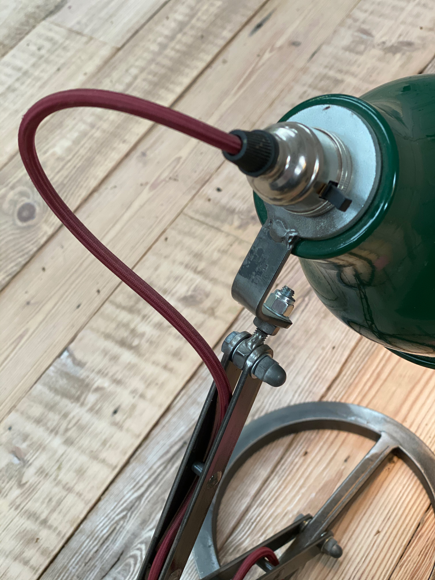 Green industrial table lamp shade with red textile cord