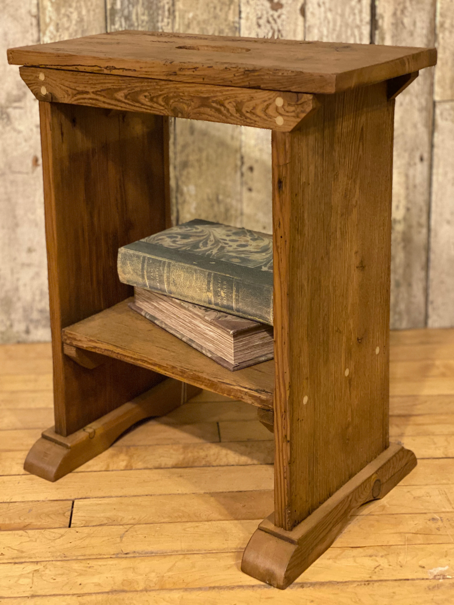 Reclaimed pine stool with books on base