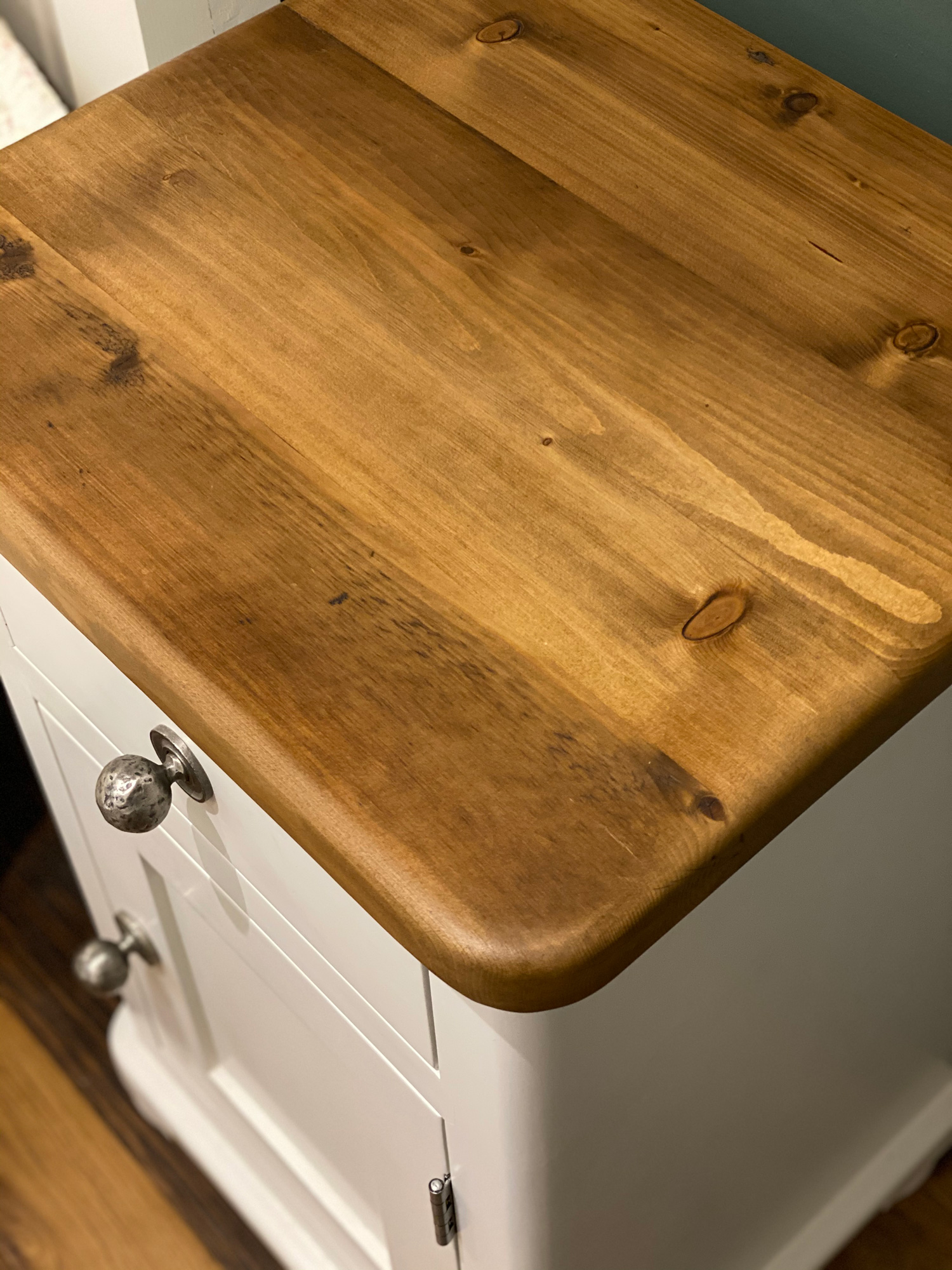 Reclaimed waxed pine worktop on painted bedside table