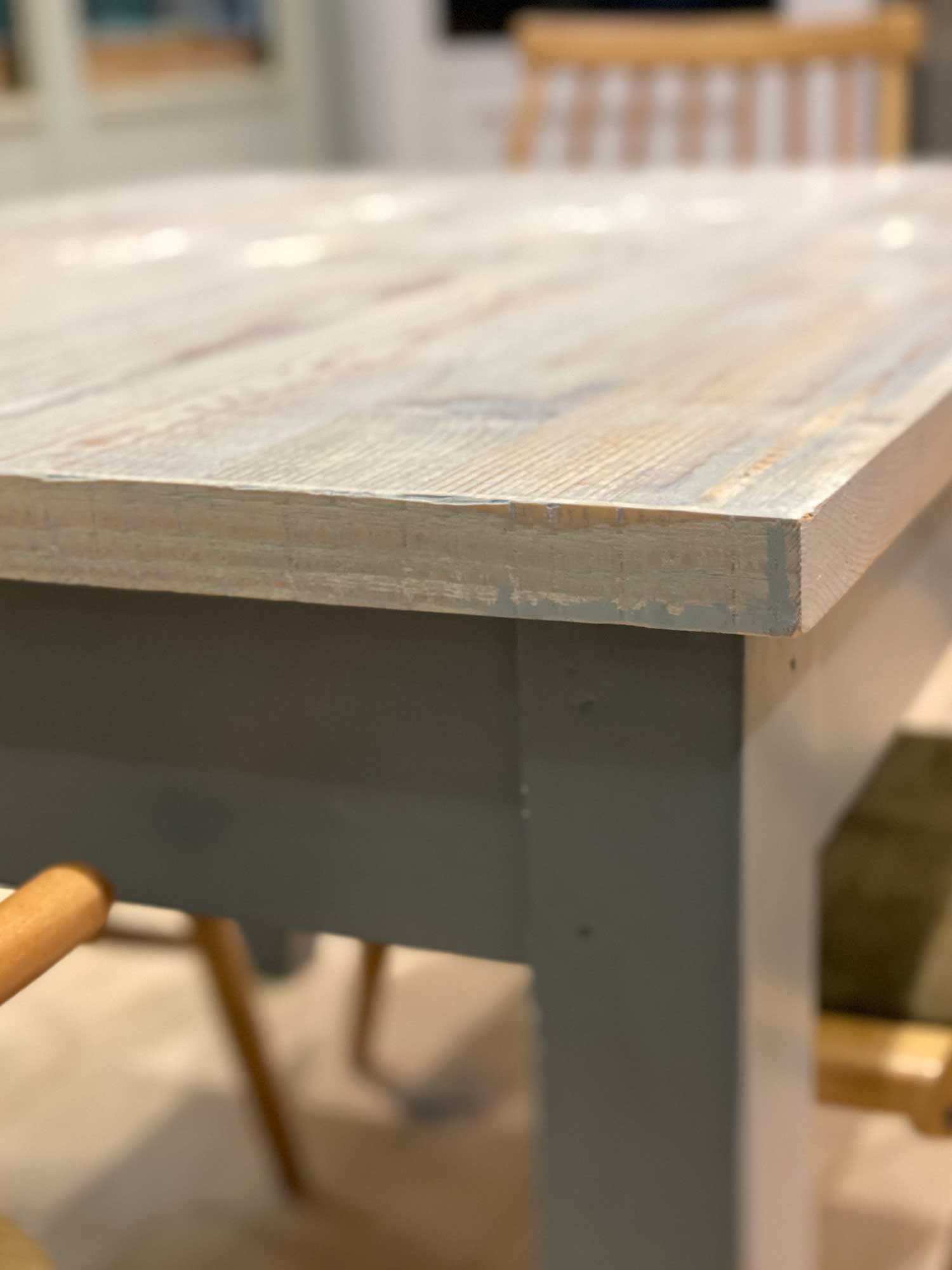 Corner detail on whitewash engineered table