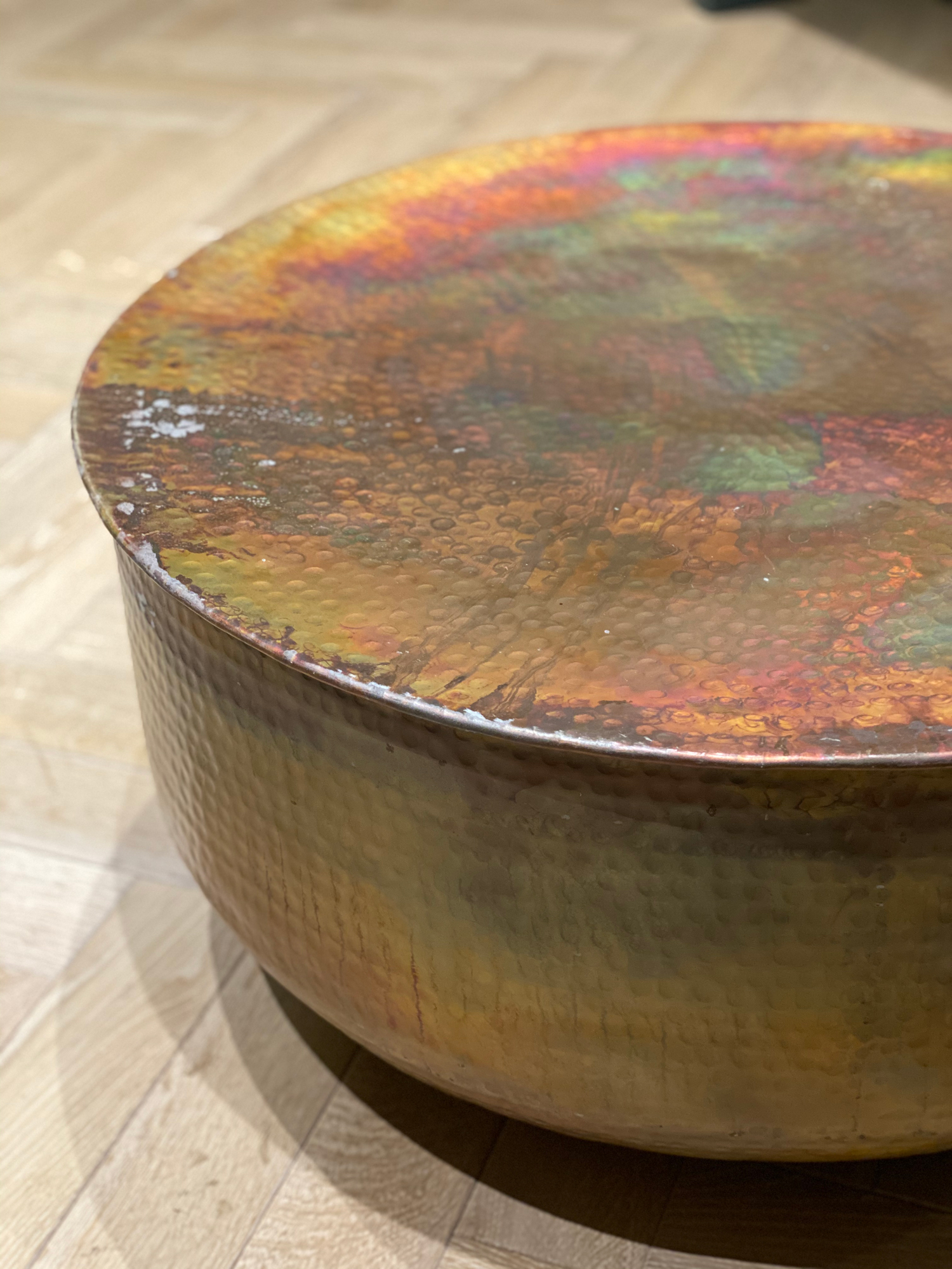 Edge detail of hammered copper round table