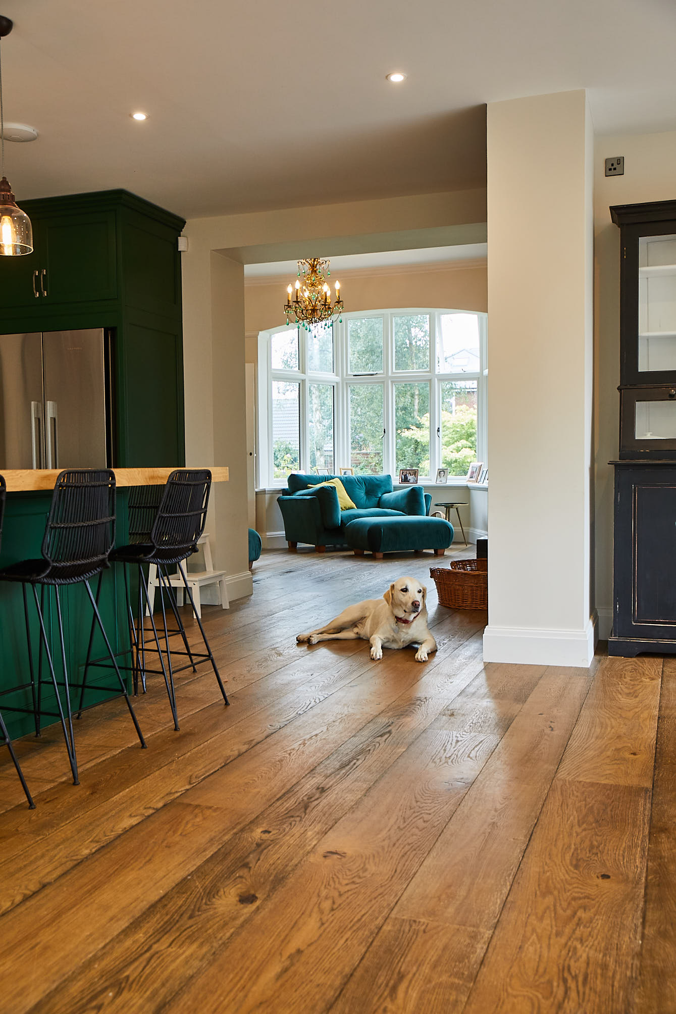 Rustic engineered oak kitchen flooring with dog laying down